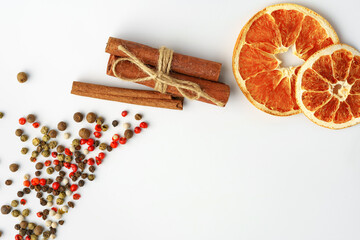 Dried oranges and spices isolated on white background