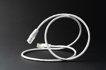 Network cable on black background studio shot