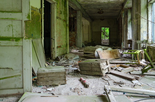Devastation in corridor of abandoned school in resettled village of Pogonnoye in exclusion zone of Chernobyl nuclear power plant, Belarus