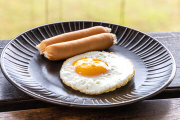 fried egg with sausage on breakfast