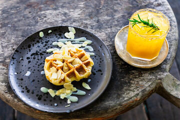 waffle with milk cream topping with almond slice