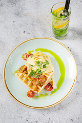 belgian waffle with egg and tomatoes