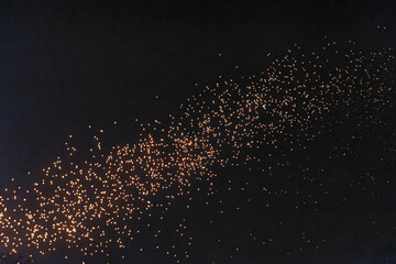 Fototapeta premium Tourist floating sky lanterns in Yi-Peng (Loy Krathong) festival , Chiang Mai ,Thailand.