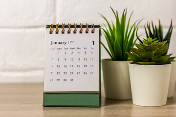 Hello January. Planning calendar for January 2024 on the desktop. - obrazy, fototapety, plakaty