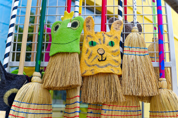 Close-up of collection of straw brooms with animal decorations at Swiss City of Zürich on a sunny hot summer day. Photo taken July 10th, 2023, Zurich, Switzerland.