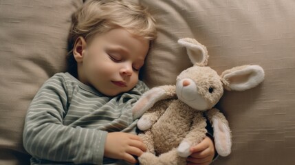 Calm scene: baby sleeping on a sleek sofa with a small plush toy.
