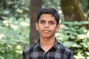 close up of young Indian boy in jungle 