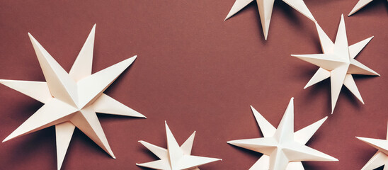 Obraz premium Merry Christmas. Hand made Christmas stars, Christmas background, holiday card. DIY Christmas flat lay. Christmas zero waste, paper, eco postcard.New year,new year poster eco friendly diy