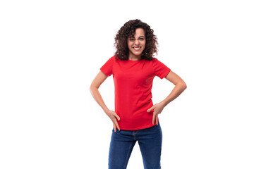 30 year old slim brunette woman dressed in a red basic t-shirt on a white background with copy space