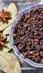 Spices cloves and star anise isolated bay leaves