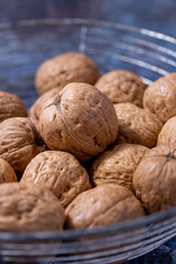 Nuts with shells in a metal basket