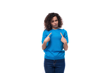 suspicious slim young caucasian woman with curls dressed in a blue t-shirt and jeans