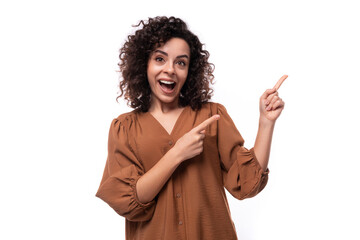 young charming assistant brunette woman dressed in a brown shirt on a white background with copy space