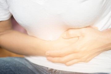 Fototapeta na wymiar Picture of woman showing abdominal pain