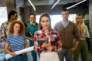 Business solutions, technology and strategy concept. Colleagues working and brainstorming in office