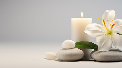 Fototapeta na wymiar a white candle, flowers and stones. spa concept. relaxation