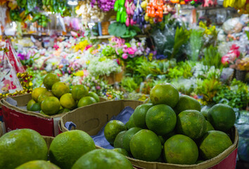Green citrus fruit for sale in the Orussey market in Phnom Penh
