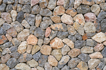 Flat lay photograph of a colorful stone wall. Stone background texture