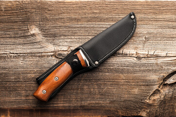 steel sharp knife on wooden background