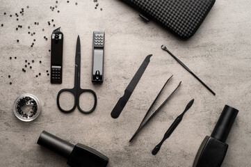 tools for manicure and pedicure on a gray background
