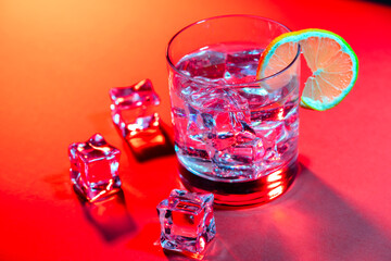 red drink with ice cubes