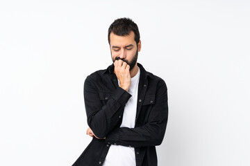 Young man with beard over isolated white background having doubts