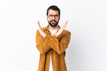 Caucasian handsome man with beard wearing a corduroy jacket over isolated white background making...