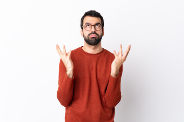Fototapeta premium Caucasian handsome man with beard over isolated white background frustrated by a bad situation