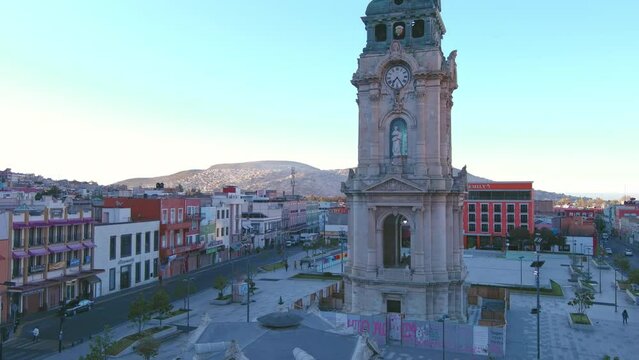 Mexico, Pachuca: Aerial view of capital city of Mexican state of Hidalgo at sunrise, Monumental Clock (Reloj Monumental de Pachuca) - landscape panorama of Latin America from above