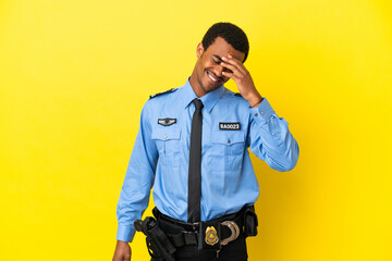 African American police man over isolated yellow background laughing