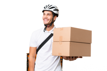 Delivery man wearing a helmet bike over isolated background thinking an idea while looking up