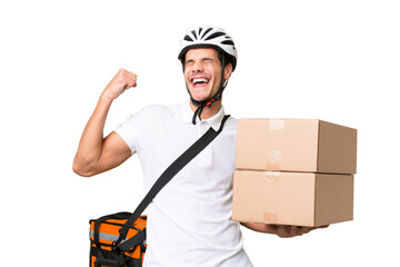 Delivery man wearing a helmet bike over isolated background celebrating a victory