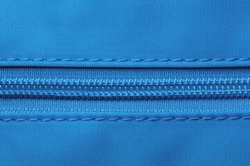 Zip fastener background texture. A high-resolution close-up of a detail from a closed plastic zip...