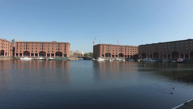 Liverpool, England, September 9, 2023: PAN SHOT The Royal Albert Dock is a complex of dock buildings and warehouses in Liverpool. Designed by Jesse Hartley and Philip Hardwick, it was opened in 1846.