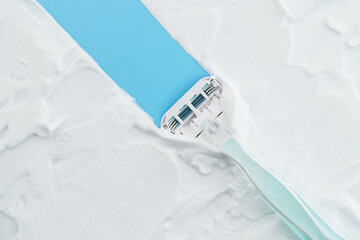 Razor glides through creamy foam, embodying the essence of a smooth, indulgent shave