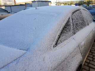 Onset of winter on November 28, 2023 in Hannover, Germany. Snowy cars and slippery roads.
