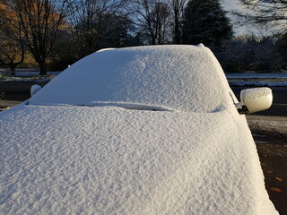 Onset of winter on November 28, 2023 in Hannover, Germany. Snowy cars and slippery roads.