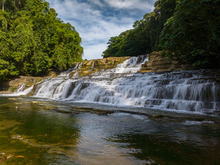 Fototapeta na wymiar Waterfalls with beautiful water stream. Tinuy-an Falls in Bislig, Surigao del Sur. Philippines.