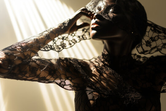 Portrait of a beautiful sensual woman covered in a black lace material
