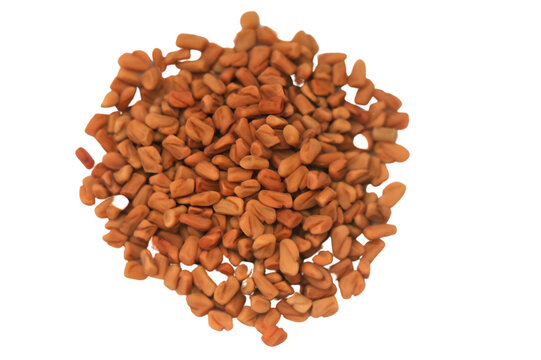 Pile of fenugreek brown dry raw seeds or grains used as ingredient for preparation of helba tea isolated on a white background.png