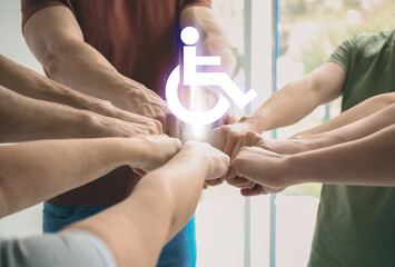 Inclusion concept. International symbol of access. People holding hands together, closeup