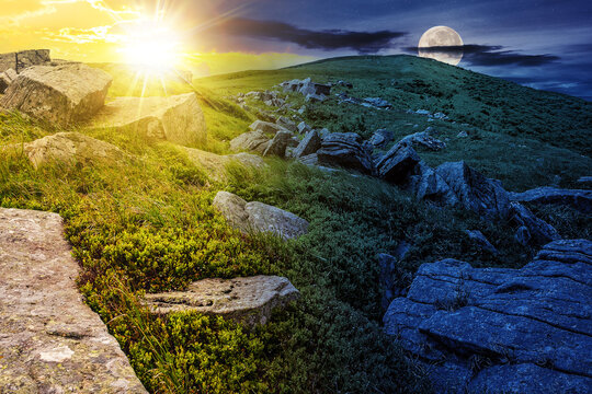 white stones and boulders on the hillside on top of Carpathian mountain range with sun and moon at twilight. day and night time change concept. mysterious countryside scenery in morning light