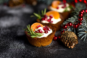 Christmas nut tartlets. Delicious, beautiful cupcakes are decorated with Christmas garlands and...
