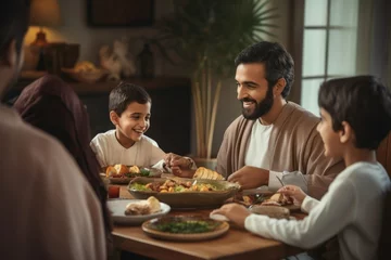Fotobehang Happy family having dinner together at home. Father, mother and children eating healthy food, Handsome arabian man talking to cheerful multicultural muslim family during dinner, AI Generated © Ifti Digital