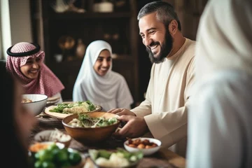 Gordijnen Muslim family having dinner together at home. Muslim man and woman sitting at table and eating healthy food, Handsome arabian man talking to cheerful multicultural muslim, AI Generated © Ifti Digital