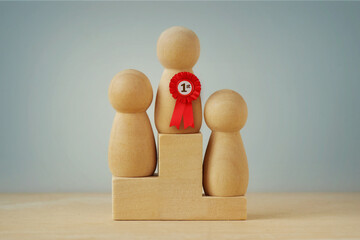 Wooden pawns standing on winner podium - Concept of winning and competition