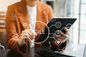 Agile development methodology concept. Business hand using laptop computer and tablet with virtual...