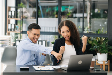  Asian business team creative businesspeople coworker, teamwork celebrating achievement and in planning design in creative in office.