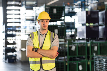 Warehouse and manufacturing concept. Portrait of male warehouse worker working and operating at...