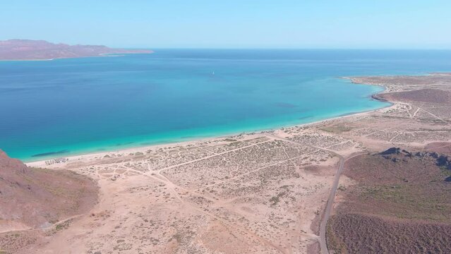 Mexico, La Paz: Aerial view of Tecolote Beach (Playa El Tecolote) with clear turquoise waters of Gulf of California - landscape panorama of Latin America from above